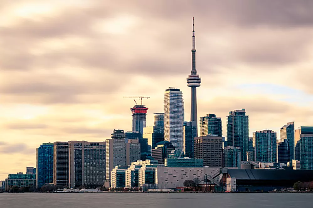 A dramatic sky behind the skyline of the city of Toronto, one of the destinations on this year's Ontario Summer Travel Guide