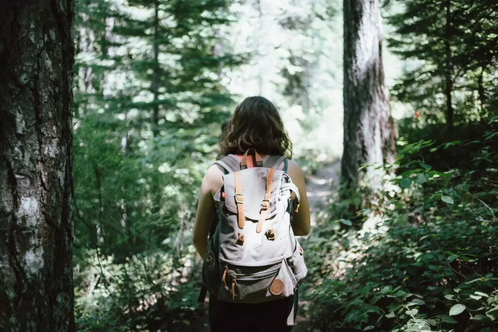 Woman walking through Reno, Nevada forest