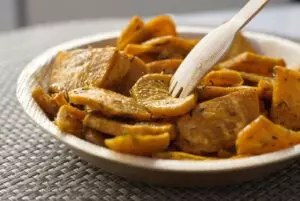 Basked sweet potato crisps in bowl