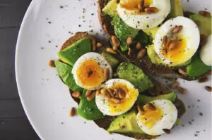 Boiled eggs with avocado in a bowl