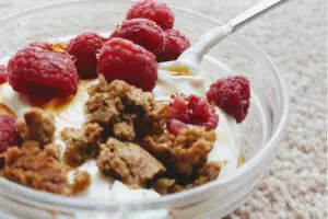 Greek yogurt parfait with berries and nuts in a bowl