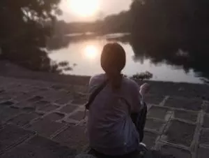 A shot depicting a person sat at the Mula River