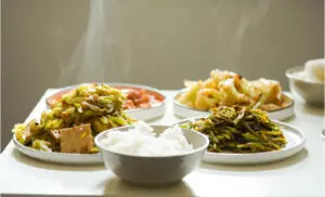 Steamed edamame beans with a dash of soy sauce and some rice